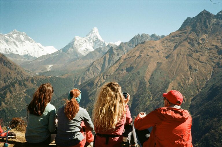 Group of hikers enjoying the stunning Himalayan view from Namche, Nepal.